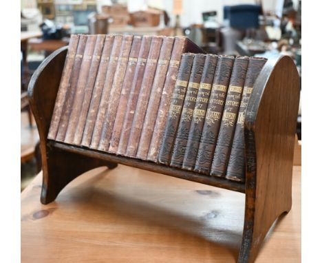 An oak book trough containing twelve volumes of Shakespeare's works 1883-86, in gilt decorative Morocco, to/w six volumes of 