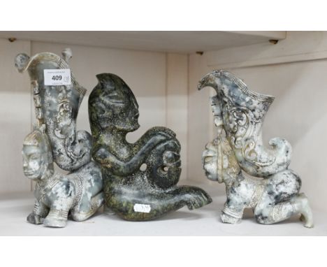 A matched pair of Chinese carved hardstone garniture vases, carved with kneeling figures supporting horns, 24 cm high, to/w a