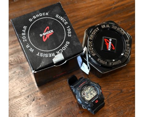 A Casio G-shock wristwatch, in fitted tin, boxed with booklet and card - unused, running at time of inspection 