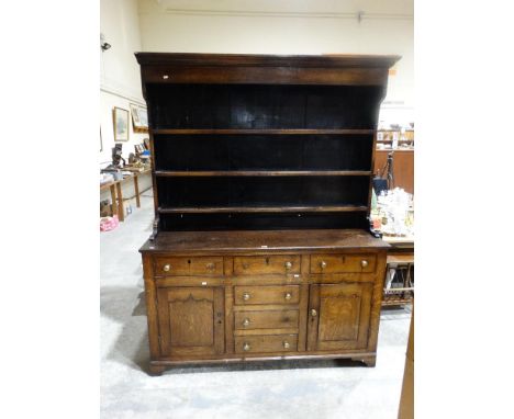     An Antique Oak Welsh Dresser Having A Three Shelf Rack, The Base Having An Arrangement Of Cupboards &amp; Drawers, 61" Wi