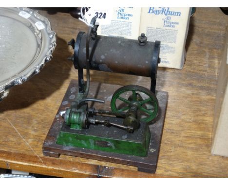     An Early 20th Century Steam Engine On A Wooden Platform Base                    