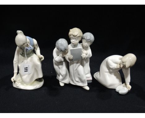    A Lladro Porcelain Figure Of Girl &amp; Slippers, Together With Two Similar Groups (3)                                   