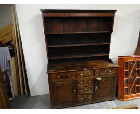     An Antique Oak Welsh Dresser Having A Three Shelf Rack, The Base Having An Arrangement Of Cupboards &amp; Drawers, 57" Ac