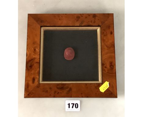 Framed relief portrait plaque of young man on ruby coloured stone, frame 8" x 7.5"
