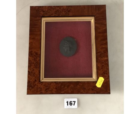 Framed relief portrait plaque of man's head on black basalt, frame 8" x 9"
