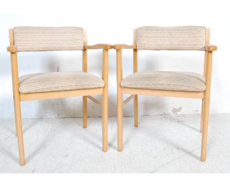 Pair of retro vintage late 20th century carver chair / dining chairs / office chairs. The chairs having curved padded backres