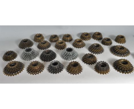 A collection of twenty four vintage 20th century bicycle cassettes by Regina Extra. Measures 12cm wide. Stamped Made in Italy