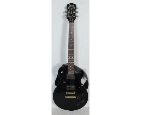 A retro vintage Ibanez Deluxe 59'er electric guitar musical instrument having , black lacquer with hardwood finger board, wit