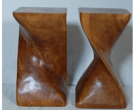 A pair of vintage 20th century exotic hardwood side tables / display stands of cuboid form with a helix swirl column. Carved 