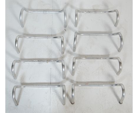 A collection of eight retro vintage late 20th century metal bicycle handlebars. Brands include 3TTT Grand Prix and more. Meas