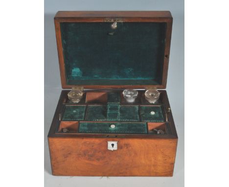 A 19th century antique Victorian flame mahogany vanity box. The box a rectangular with a mother of pearl inlaid decoration to