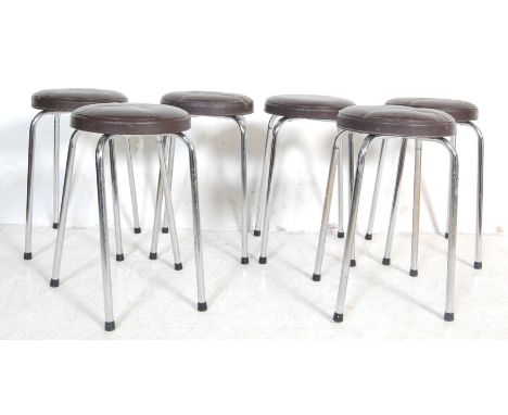 A set of six retro vintage late 20th century bar stools having a brown leatherette cushioned seat raised on chrome tubular le