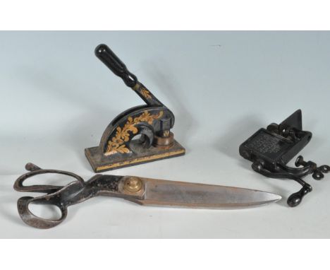 A collection of three vintage 20th century haberdashery items comprising of a large pair of scissors stamped J Wilkinson &amp