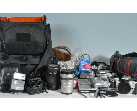 A large collection of vintage 20th century camera equipment comprising of a Kodak 1, Canon eos300, Fujifil, Canon Powershot, 