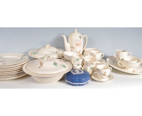A 44 pieces Royal Doulton ceramic dinner service in the Coppice pattern consisting of plates of various sizes, tureens, cups,