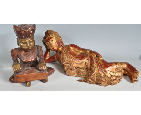 A large 20th century antique style mantel piece Buddha figurines and a Indian musician figurine. The large wooden figurine de
