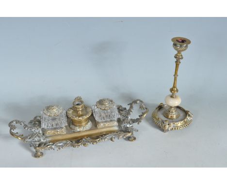 An early 20th century rococo style brass and cut glass ink well / desk tidy having two cut glass and brass topped inkwells of