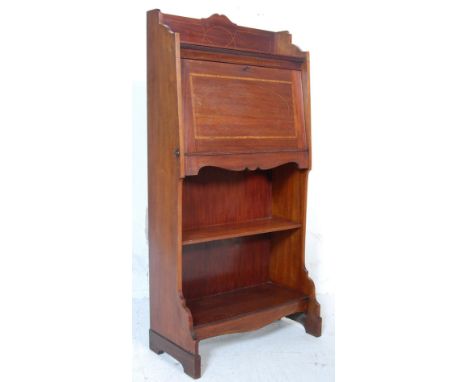 An antique Edwardian early 20th century mahogany inlaid student bureau having a gallery back with a fall front writing area o