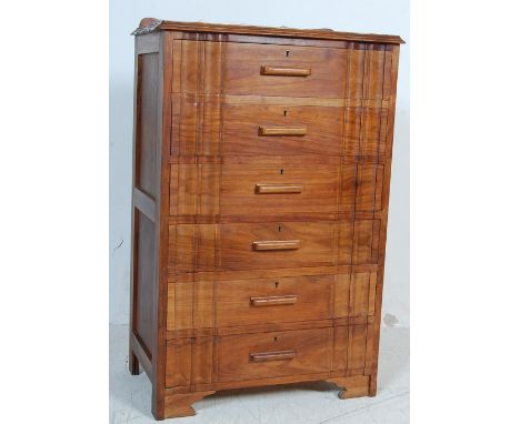 A vintage retro 20th century Art Deco style walnut chest of drawers. The chest having a scrolled top, bank of six drawers wit