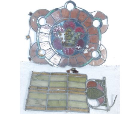 A vintage 20th century ecclesiastical lead &amp; stained glass window of rosette form having a central image of a crown. Toge