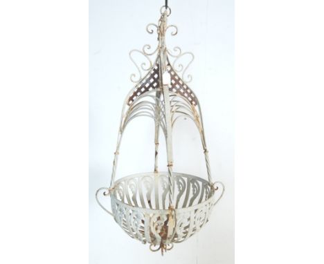 A vintage 20th century blacksmith metal hanging basket, the bracket of a large teardrop form with twisted columns, scrolled d
