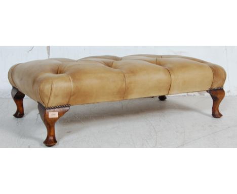 An early 20th century circa 1903’s leather stool / ottoman. The stool having cream leather button top raised on cabriole legs