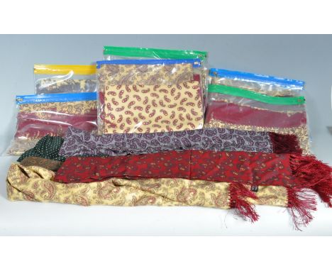  A large collection of approximately fifteen vintage 1950s gentleman's English made Tootal mod style paisley scarves in a var