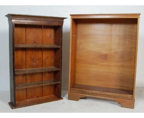 Two antique early 20th century and later bookcases comprising of an oak bookcase having a flared top over three shelves raise