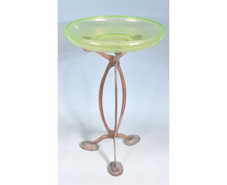 A 20th century carnival glass iridescent dish in the manner of Tiffany having a shallow basin and stepped base. Diameter meas