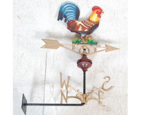 An antique style cast iron polychrome weather vane having cockerel to the directional arrow with gilt points of the compass b
