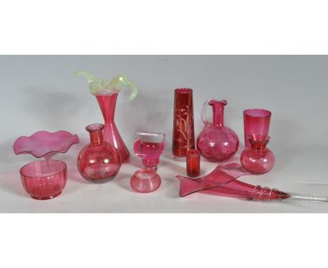 A collection of vintage 20th century cranberry and ruby glassware comprising of vases, bowls beakers, jugs,&nbsp;ornaments an