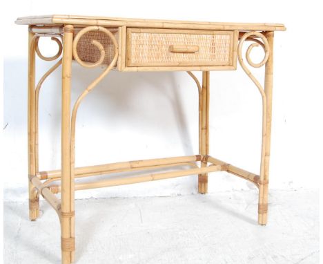 A vintage retro late 20th century bamboo dressing table of a rectangular form with single drawer to the frieze flanked by two