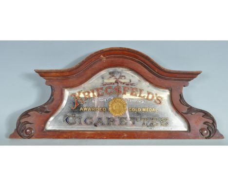A vintage 20th century advertising point of sale shop display mirror backed sign advertising Kriegfelds Cigarettes. The sign 