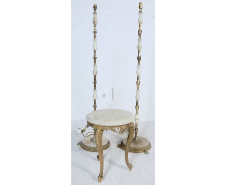 A pair of vintage 20th century Onyx floor standing lamps and side table. The lamps having turned Onyx columns with brass spac