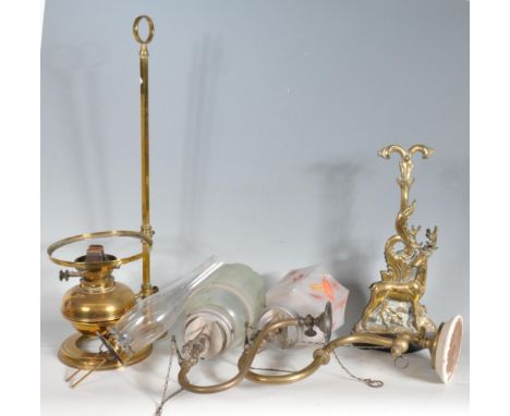 A collection of three antique early 20th century and later brass items to include an oil lamp with a white glass shade a pair