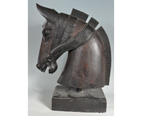 A large 20th century mantel piece sculpture/ carousel horse / oak carved horse head. The large head having headdress carving 