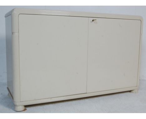 A 20th century Art Deco antique style white enamel sideboard. The two door sideboard of a large rectangular size having shape