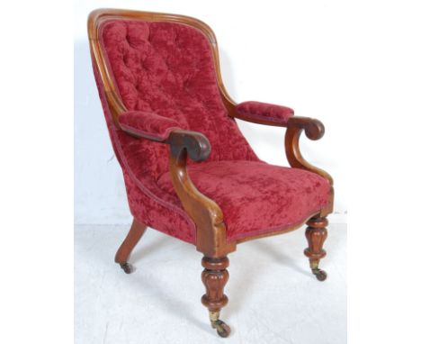 An early Victorian 19th century show wood mahogany armchair. Raised on fluted legs with castor feet having a good overstuffed
