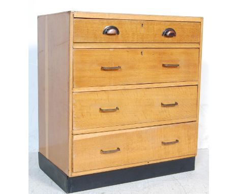 A retro vintage mid 20th century Air Ministry style chest of drawers having a flip down / plan drawing top drawer and three d