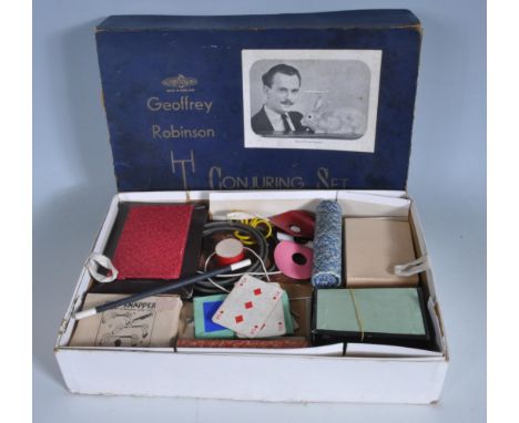 GEOFFREY ROBINSON CONJURING SET. Circa 1950 boxed with lift out tray. Variety of magic tricks with: "Demon Snapper", playing 