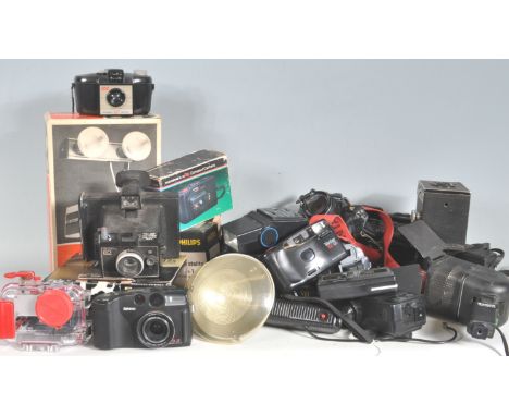 A large collection of vintage retro 20th century and later camera and photographic cameras accessories to include Pentax MV1,