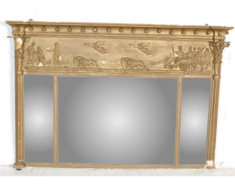 A regency style gilt over mantel mirror with panel atop depicting a Roman chariot drawn by six lions, the three bevelled mirr