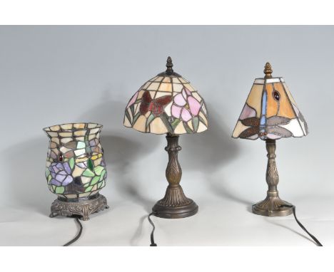 A set of three vintage 20th century Art Nouveau Tiffany style lamps comprising of two desk bedside lamps having naturalistic 