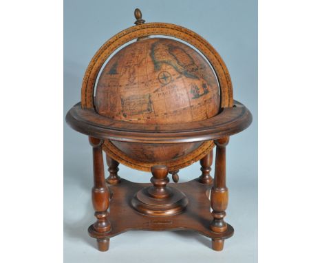 A vintage retro 20th century antique style terrestrial globe. The globe of small proportion having&nbsp;latitude and longitud