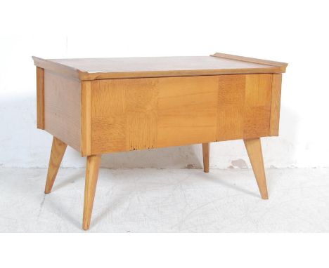 A vintage retro 1970’s Danish inspired light oak sewing box of a rectangular form with hinged lead and fitted interior raised