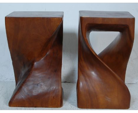 A pair of vintage 20th century exotic hardwood side tables / display stands of cuboid form with a double helix swirl column. 