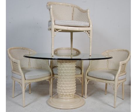 A 20th century Danish inspired dining table and four chairs. The large dining table having a circular glass top above a white