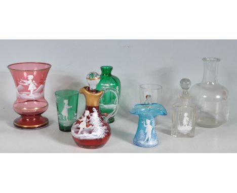 A collection of early 20th century Mary Gregory style coloured glass comprising of crimson jug with stopper, a clear vase wit