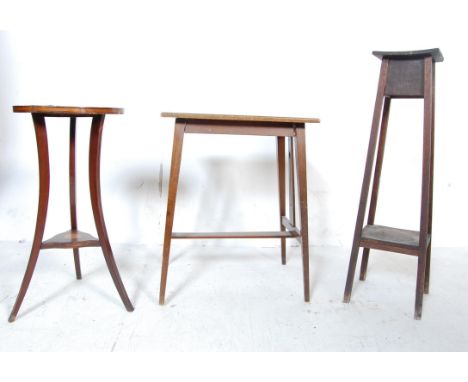 An early 20th century Arts and Crafts mahogany side table of a rectangular form with decoration to the side legs panel raised