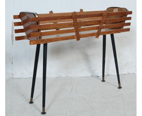 A vintage retro 20th Century planter / plant stand trough having a slatted teak wood body with a green painted metal insert r